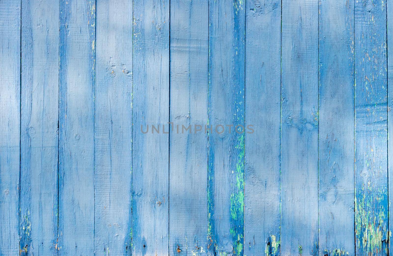 Old wooden background of boards with cracked and peeling paint. Wooden texture.