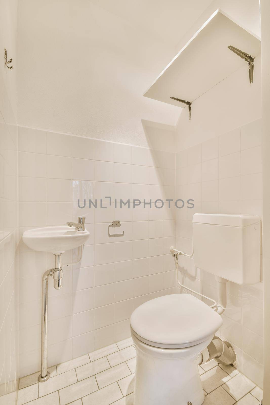 Modern white toilet with ceramic walls and tiles