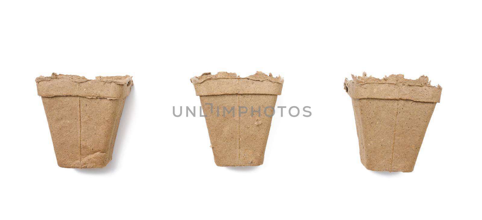 Empty paper pots for planting seed on white isolated background, set