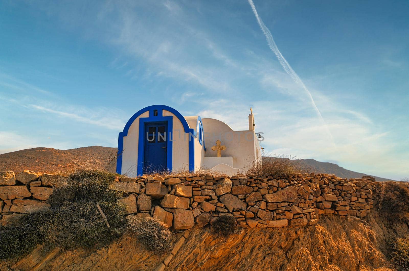 Small white church with dome in Anafi island