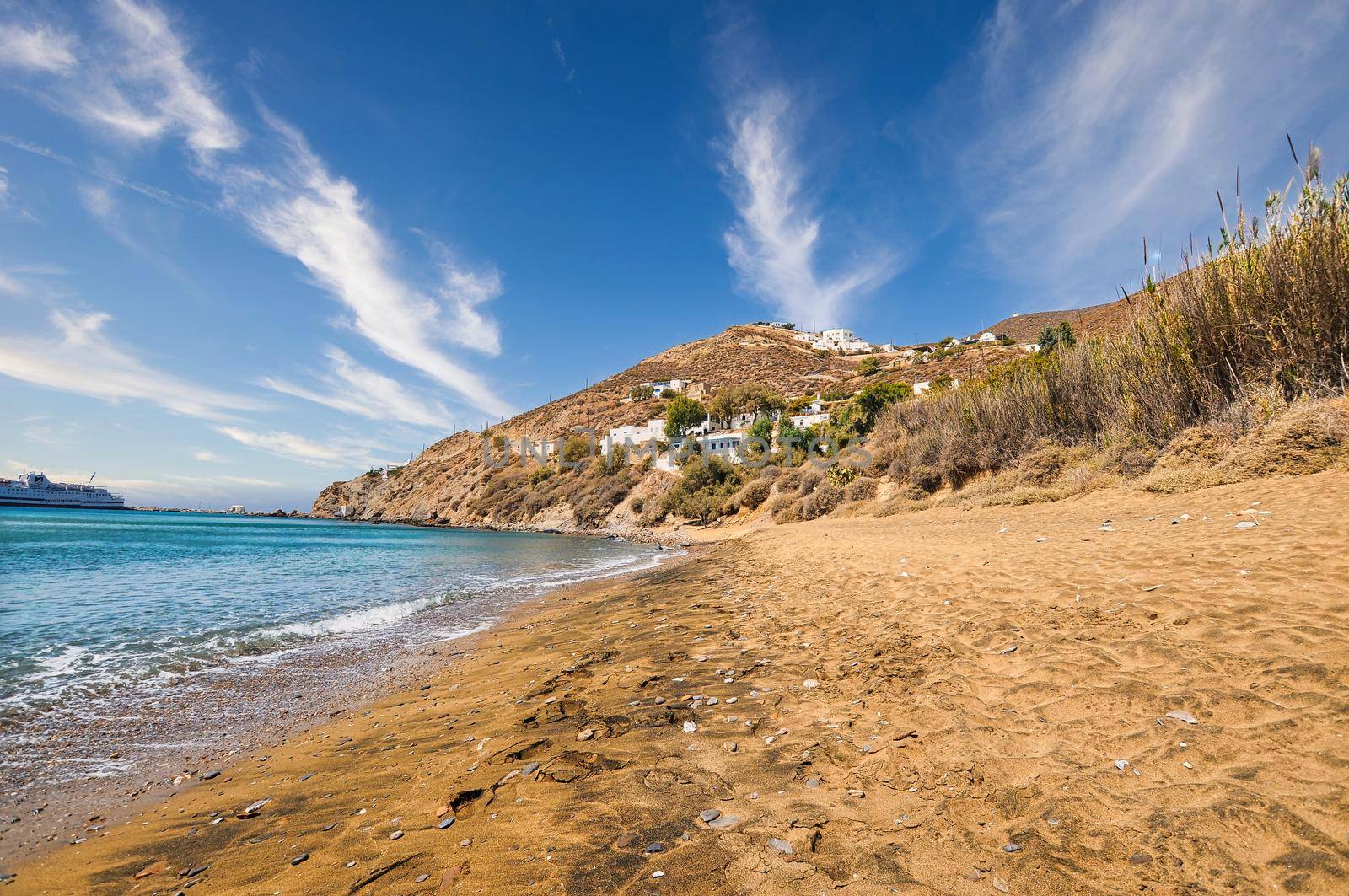 View of Klisidi beach in Anafi, with a ferry boat in the sea