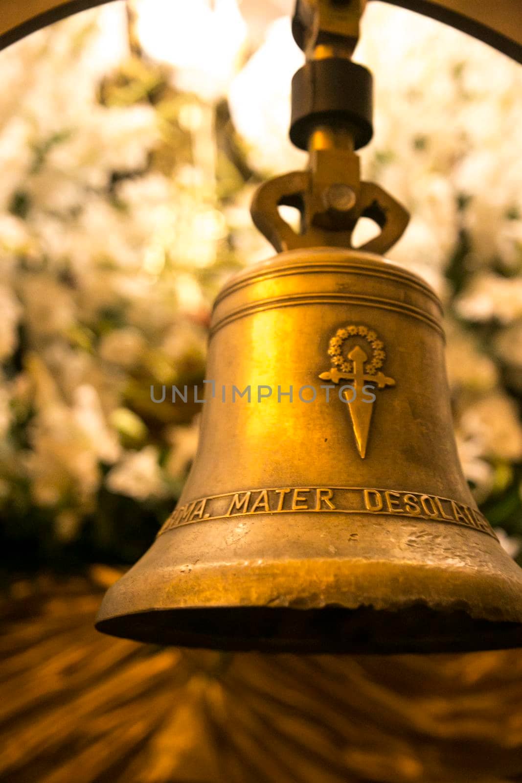 Elche, Spain- April 12, 2022: Golden Bell of Mater Desolata Virgin Mary Easter Parade inside the church of Santa Maria in Elche