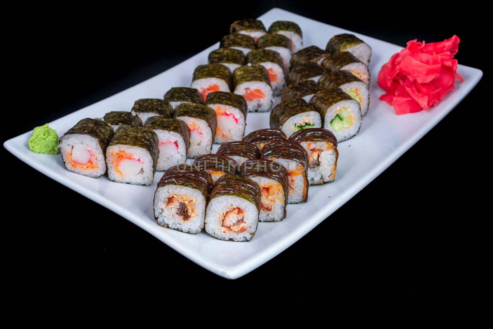 Japanese Cuisine - Sushi Roll with Shrimps and Conger, Avocado, Tobiko and Cheese. sushi rolls tempura,japanese food style