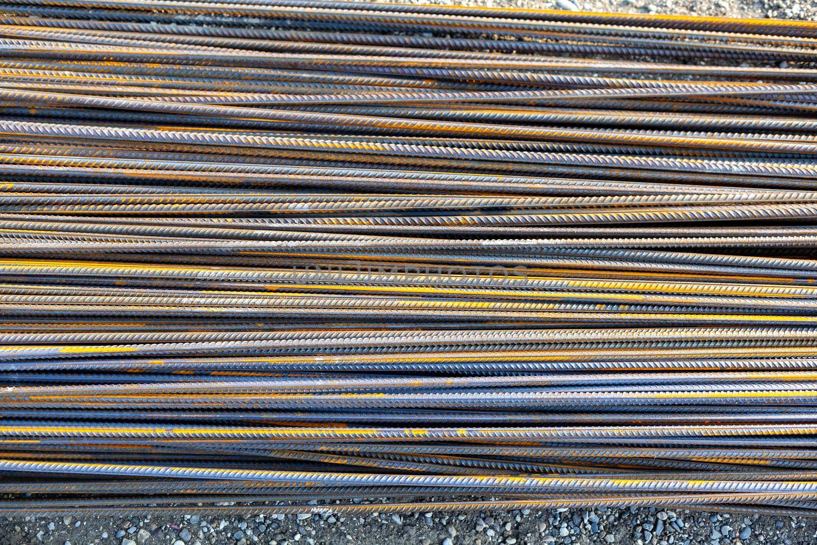 Old metal rusty or steel rod. A lot of rebar is in the warehouse by AnatoliiFoto
