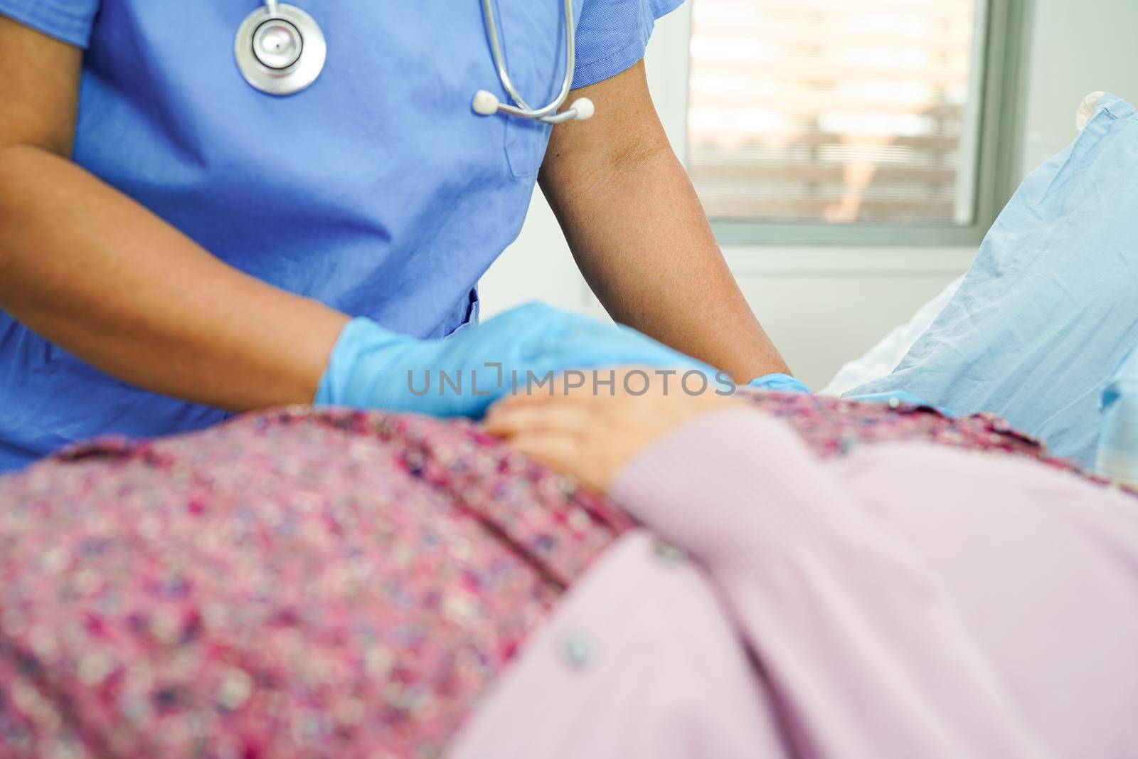 Doctor check Asian elder senior woman patient wearing a mask for protect covid coronavirus.      