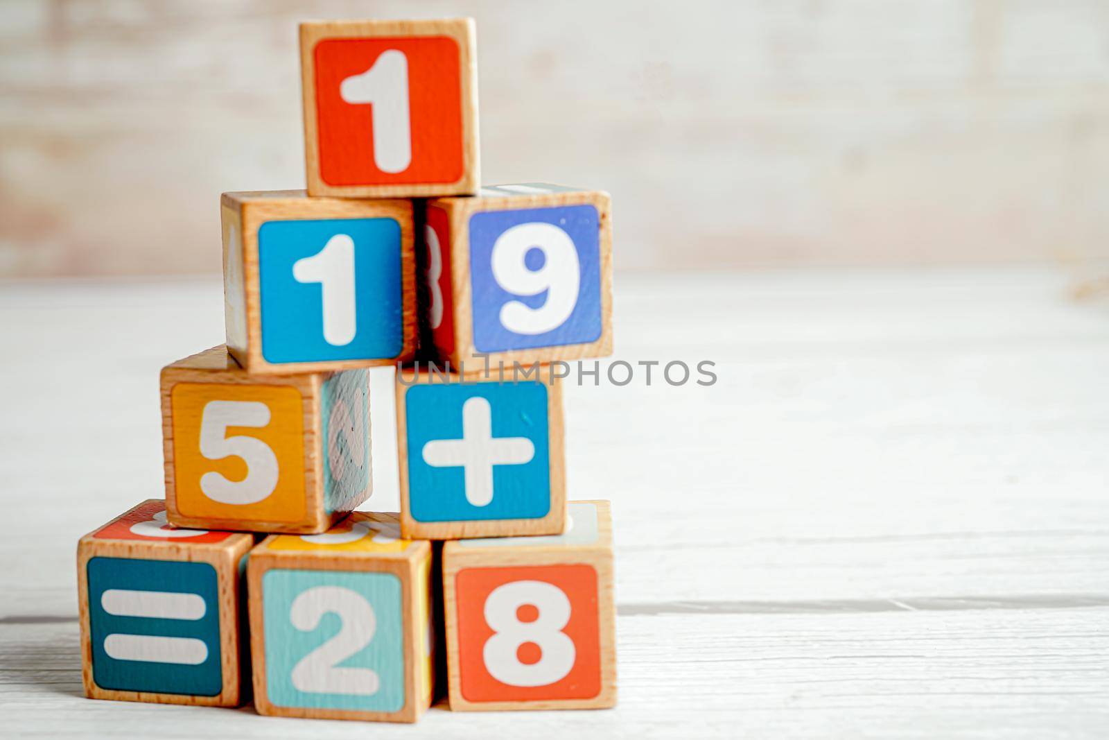 Number wood block cubes for learning Mathematic, education math concept.