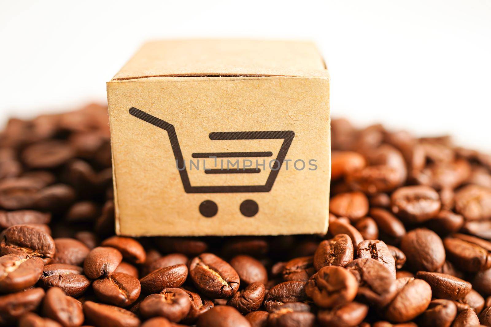 Shopping cart box on coffee beans, shopping online for export or import
