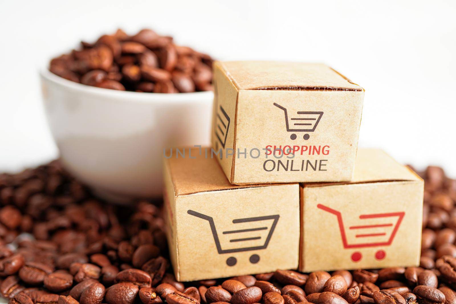 Shopping cart box on coffee beans, shopping online for export or import.