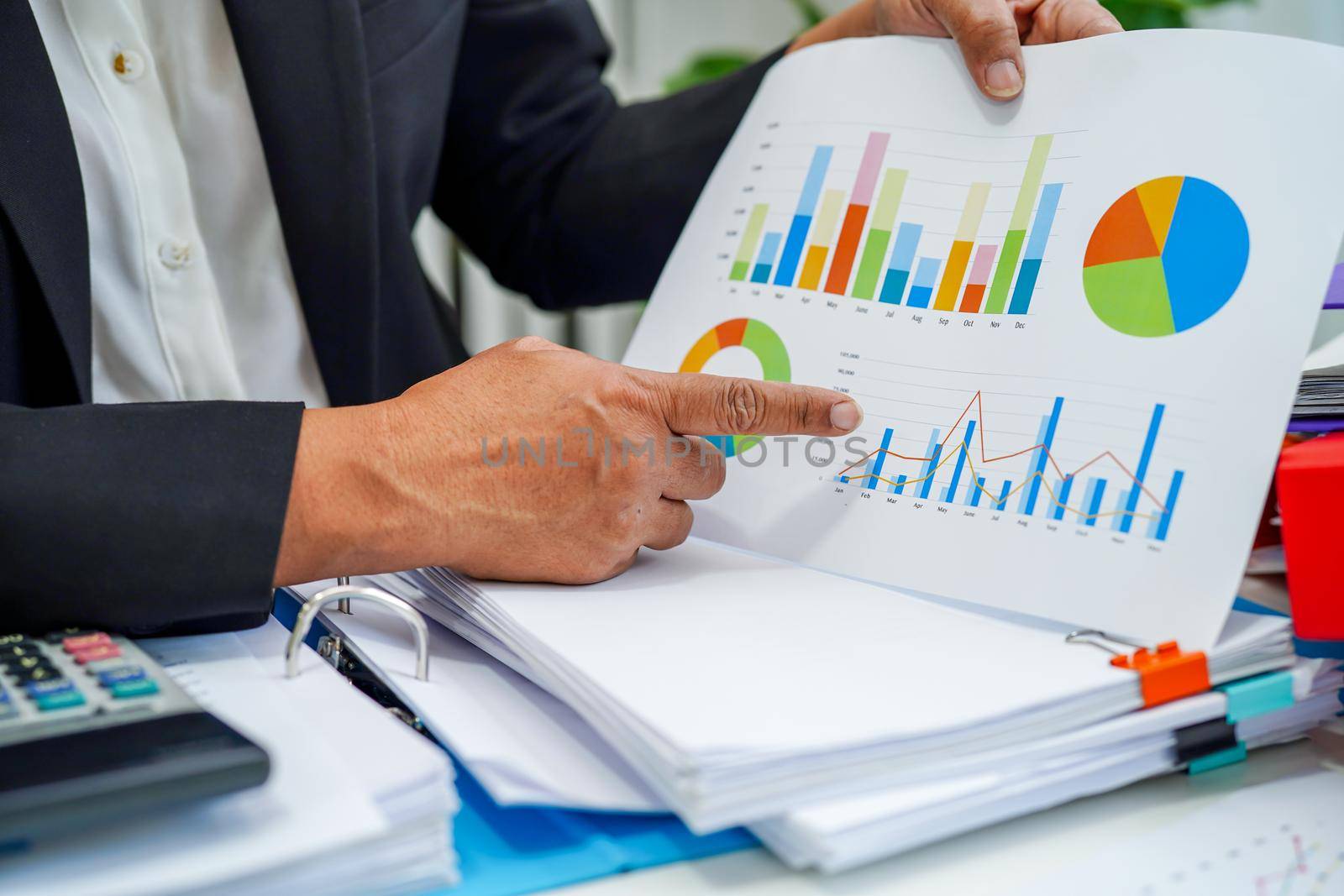 Businessman working and analysis with statistic graph in office. 