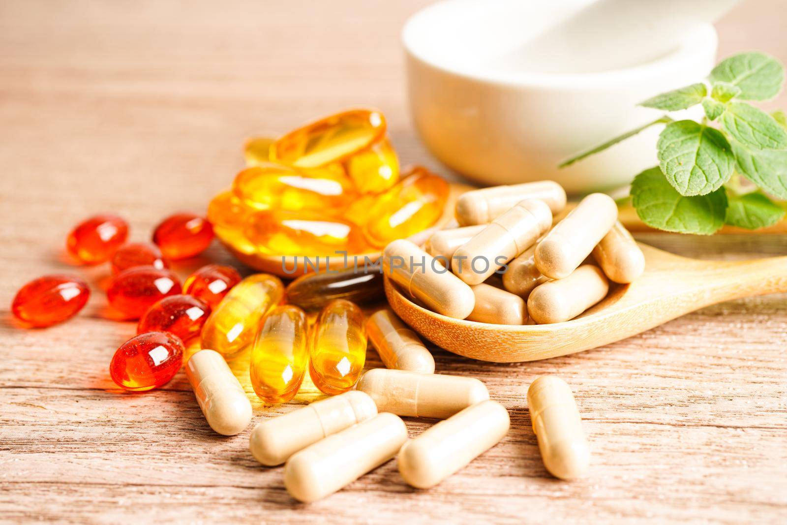 Alternative medicine herbal organic capsule with vitamin E omega 3 fish oil, mineral, drug with herbs leaf natural supplements for healthy good life.