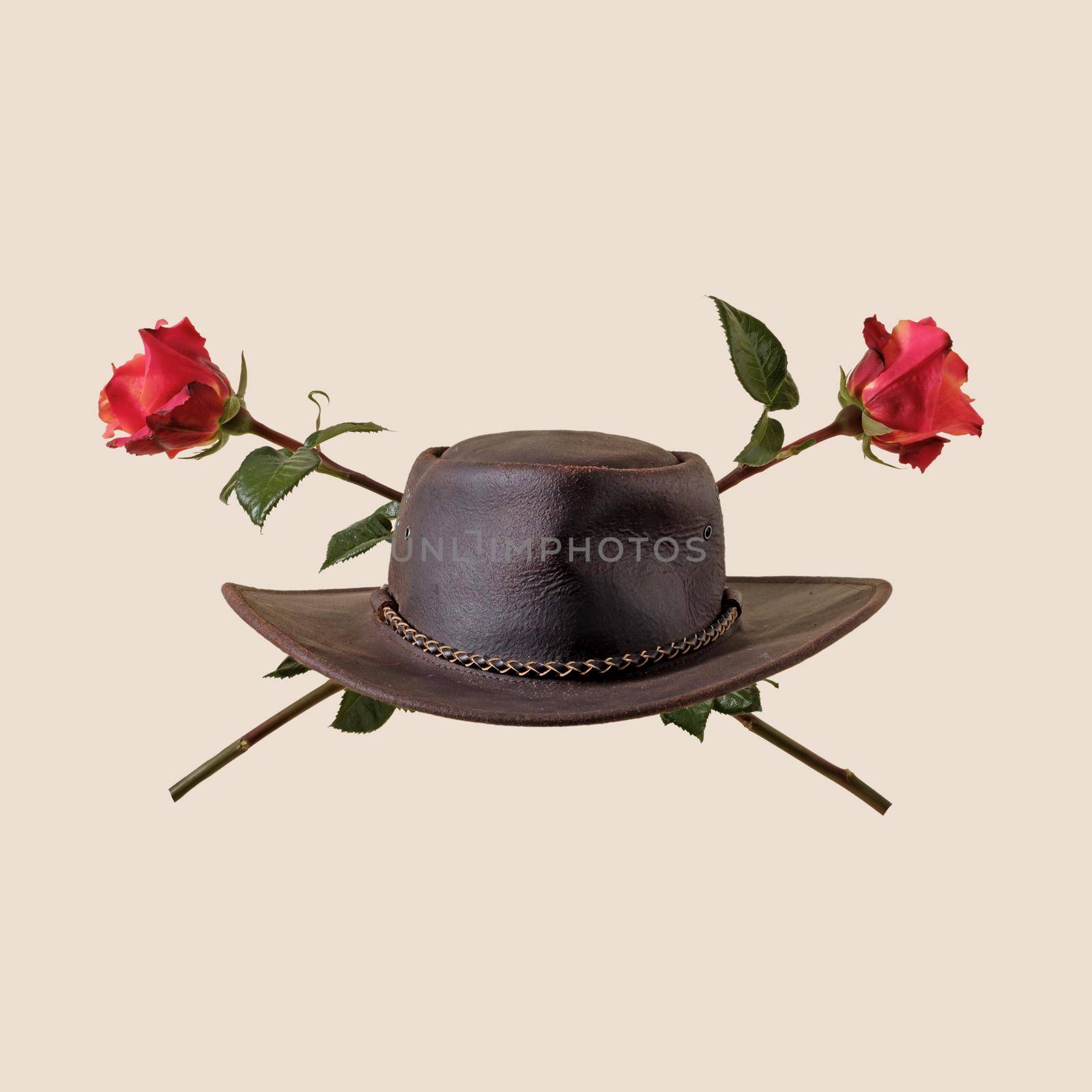 Cowboy hat and rose flowers wild west party concept classic stetson and american western.