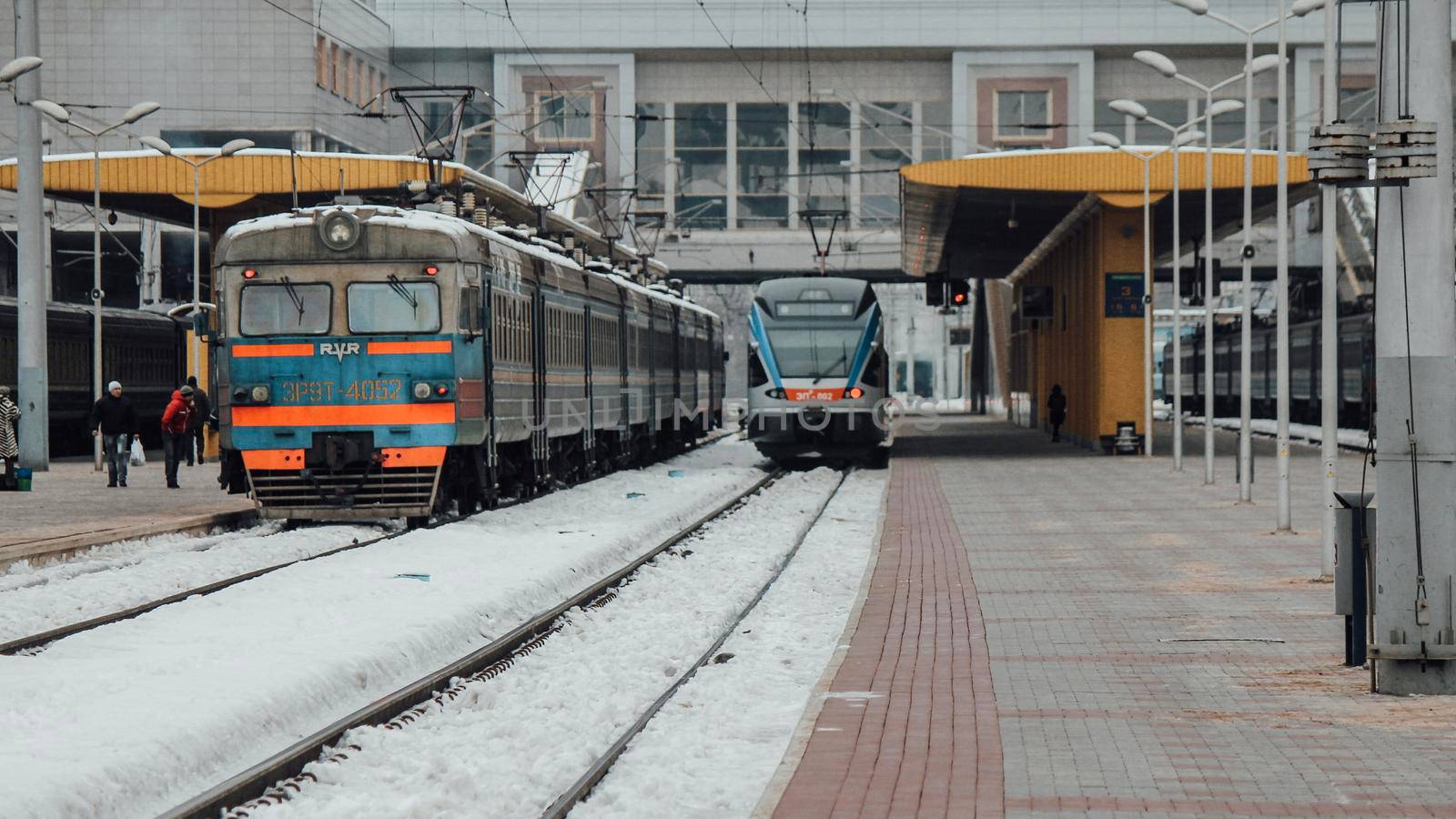 The train arrives at the passenger platform in Minsk on a winter day by grekoni