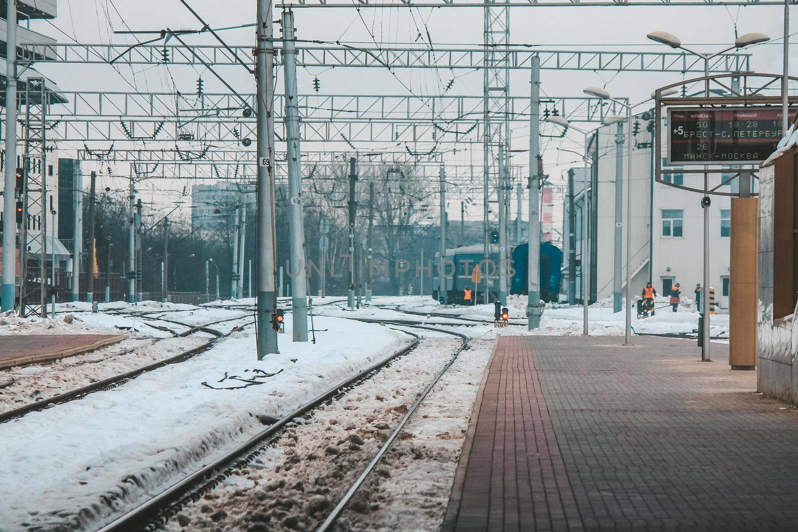 The train arrives at the passenger platform in Minsk on a winter day by grekoni