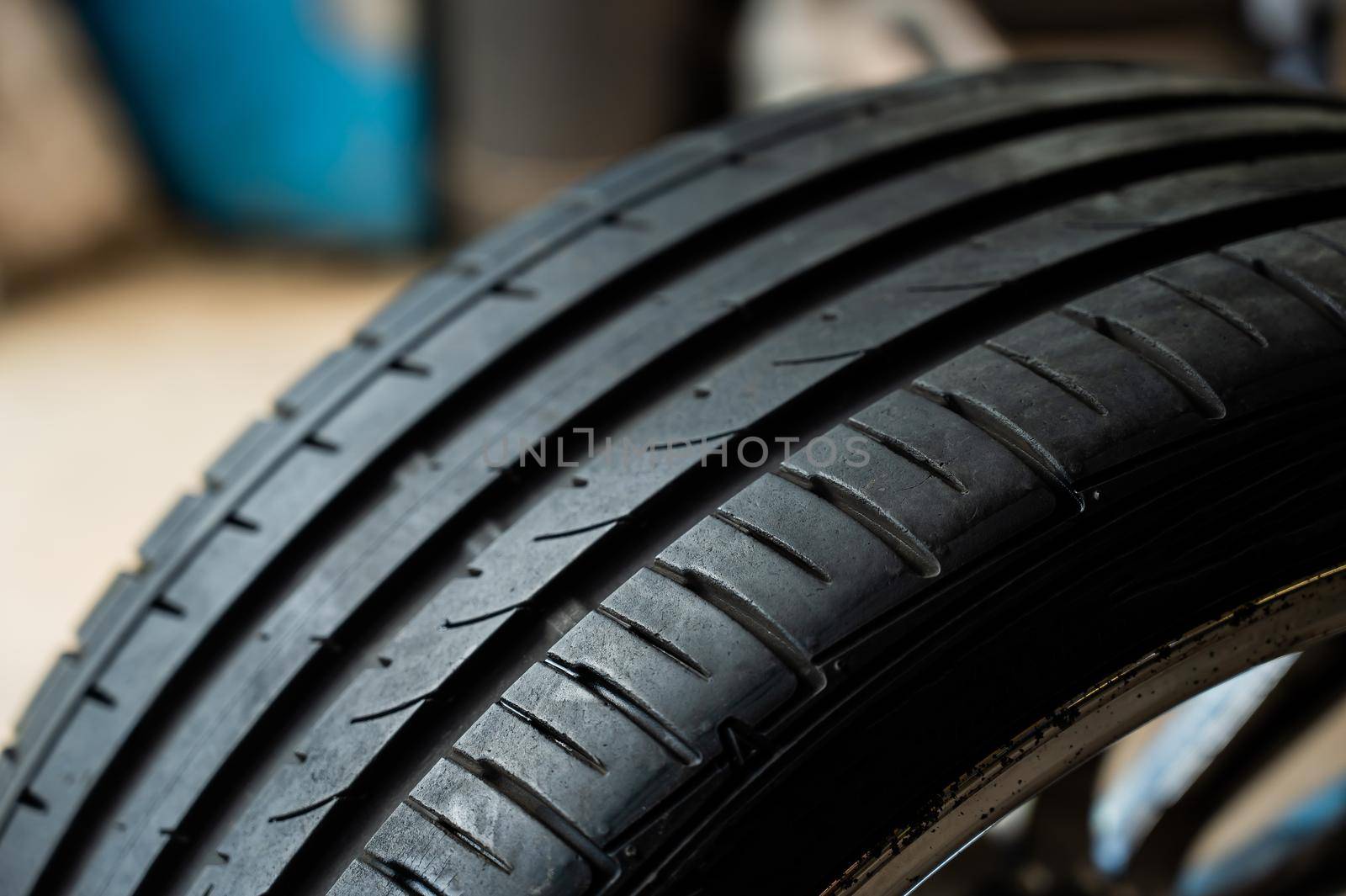 Close-up of a new car tire with a tread