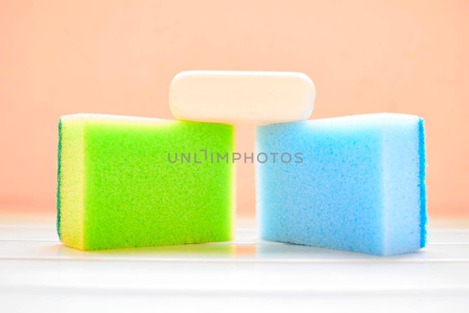 Green blue sponges and white soap for cleaning by jovani68