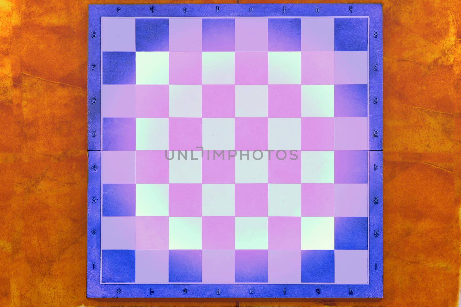 Blue purple chess board with pink space for text on orange red background by jovani68