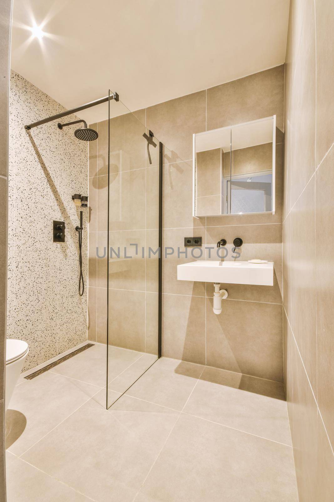 Moder glass shower with marble everywhere and glass door