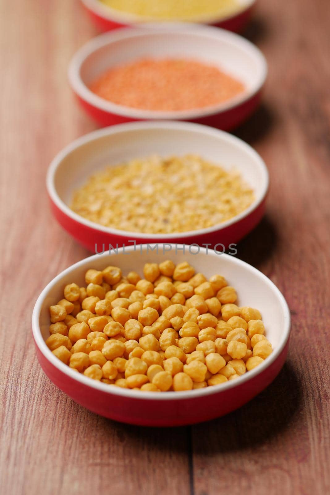 Bowl of uncooked dhal on table top view ,