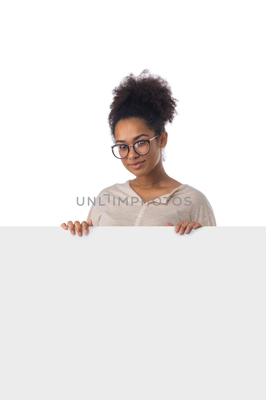 Cheerful black woman holding white blank banner with copy space isolated on white background