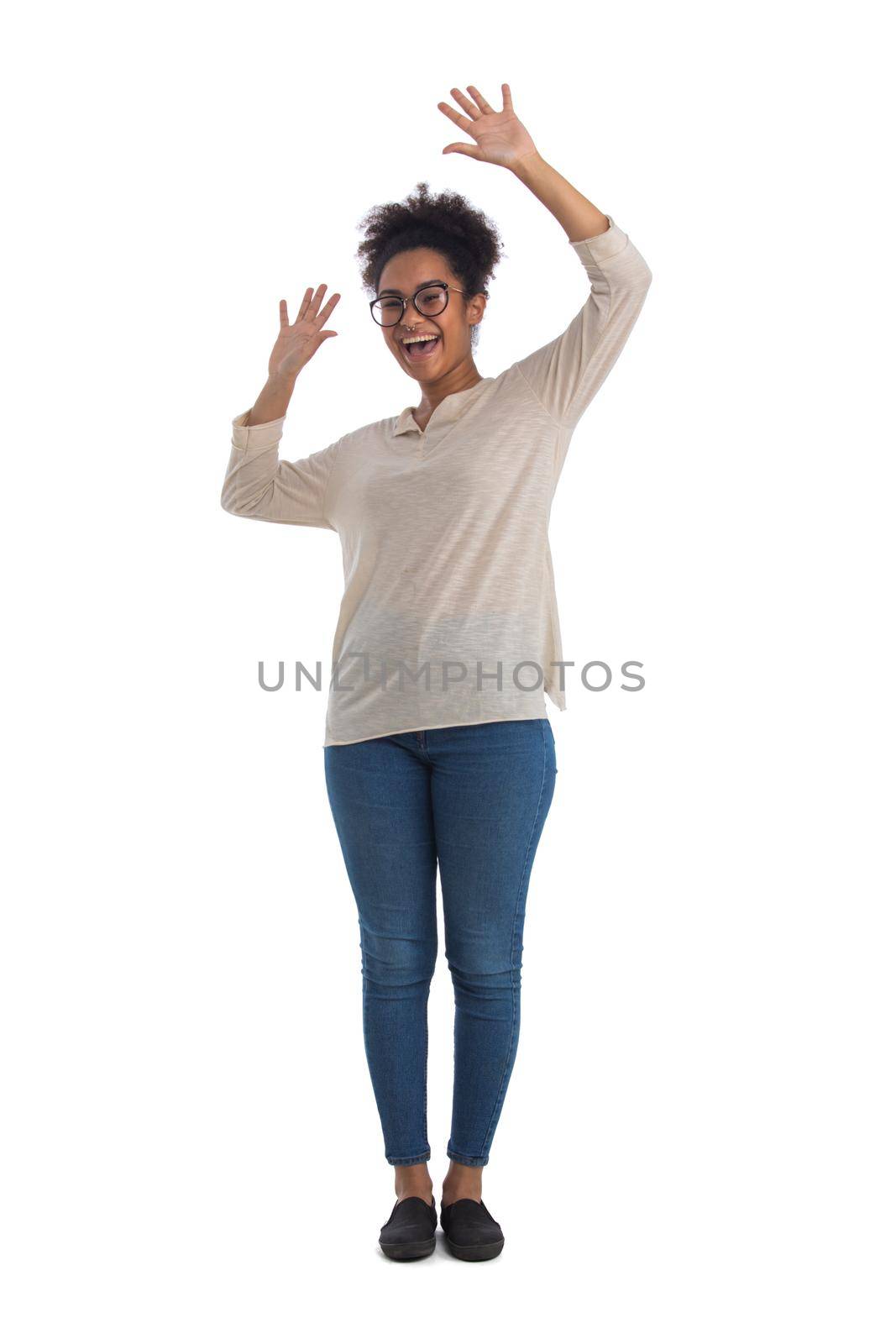 Full length portrait of a cheerful young mixed race woman with arms raised isolated on white background