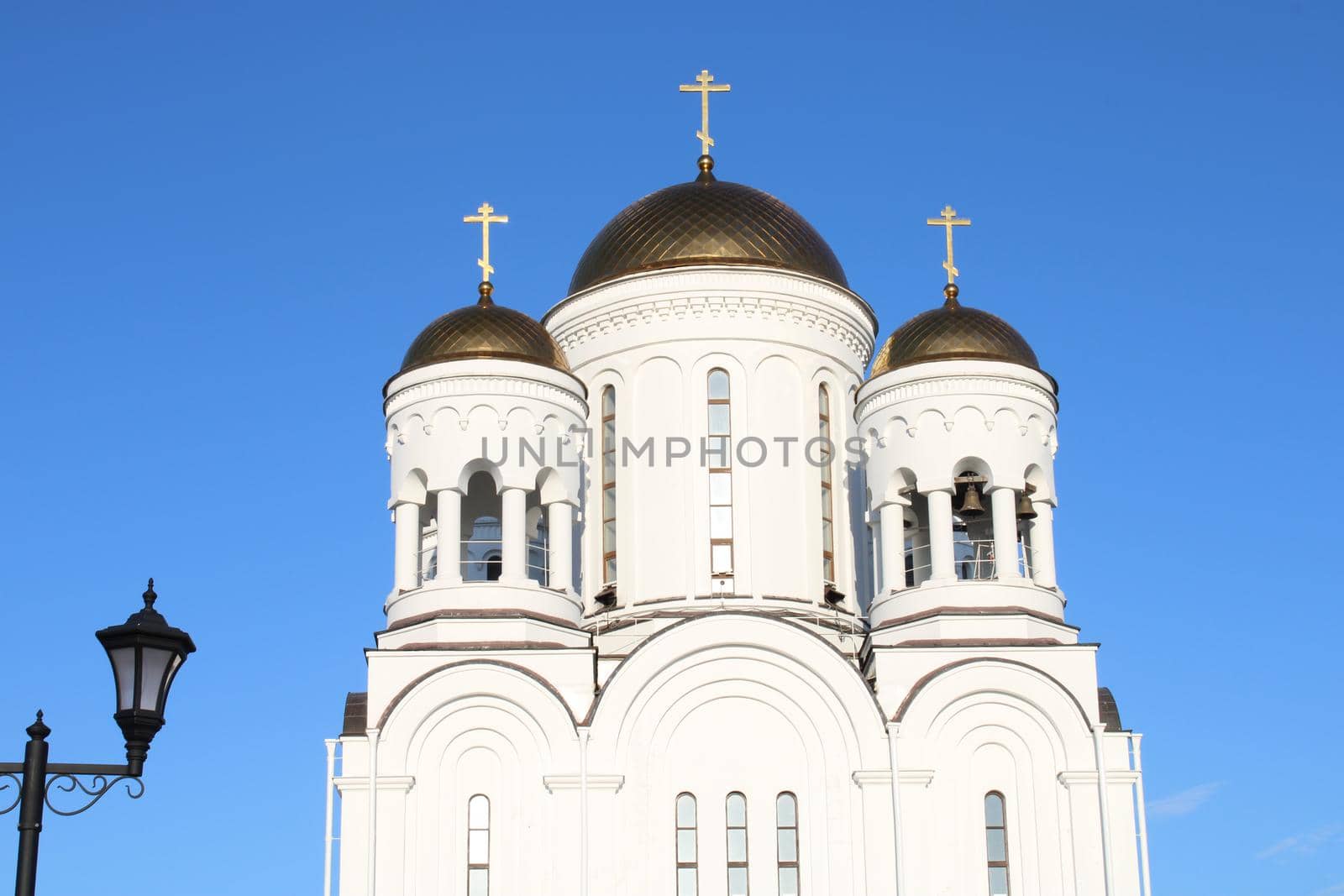 The church is made of white stone. Religion. Orthodoxy. Architecture. High quality photo