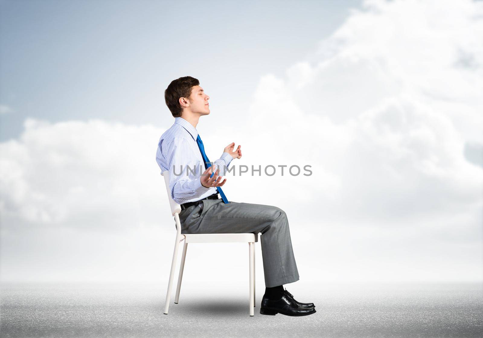 businessman sitting on an office chair, meditation and calmness