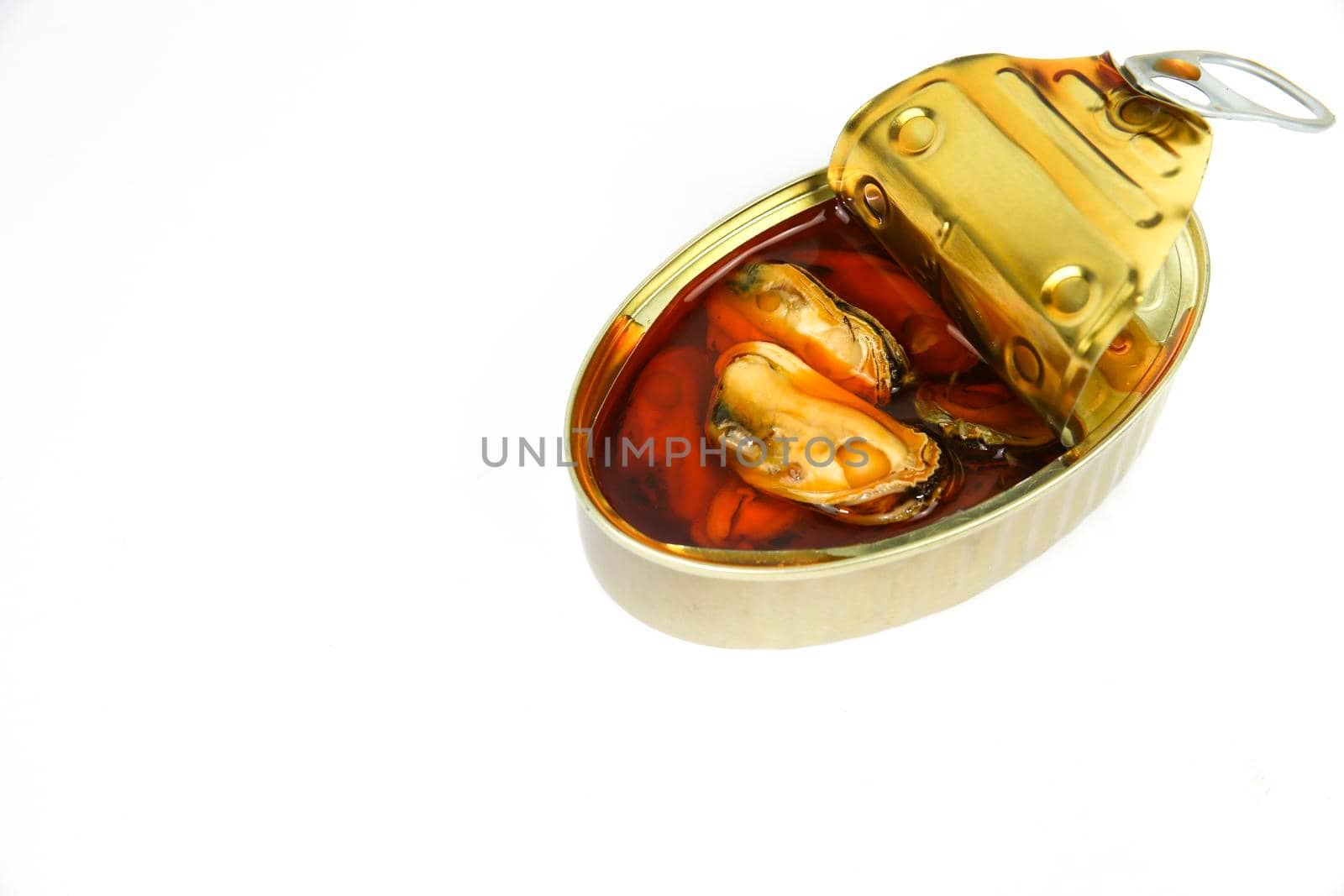 Can of tasty pickled mussels on white background