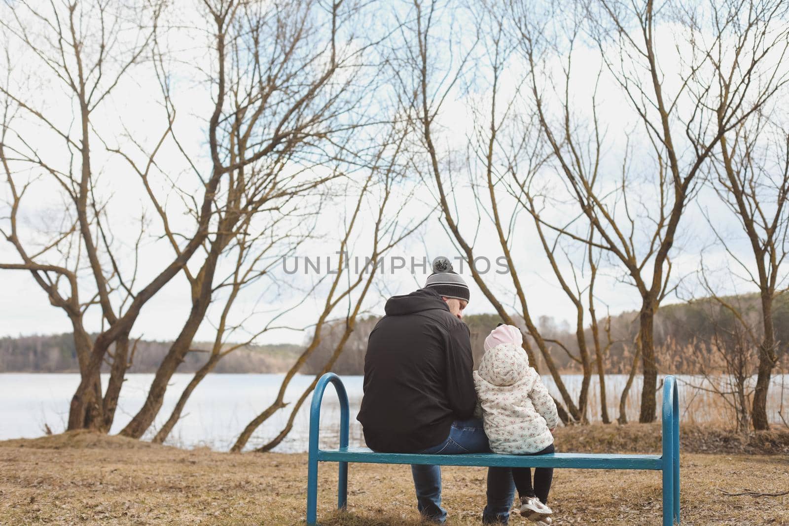 Father and little daughter outdoors. Family spending time in nature.