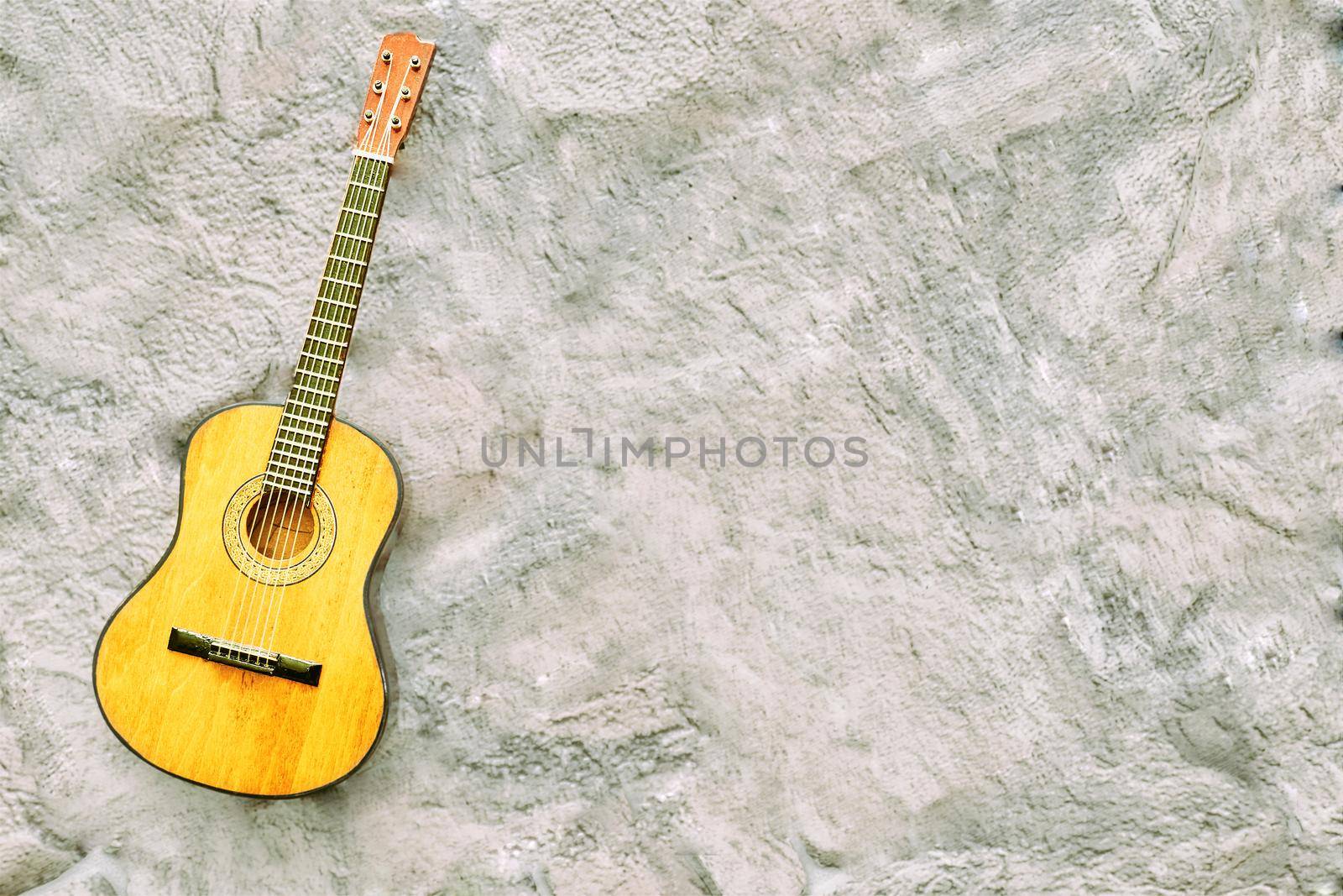 a brief record of facts, topics, or thoughts, written down as an aid to memory. a stringed musical instrument, with a fretted fingerboard, typically incurved sides, and six or twelve strings