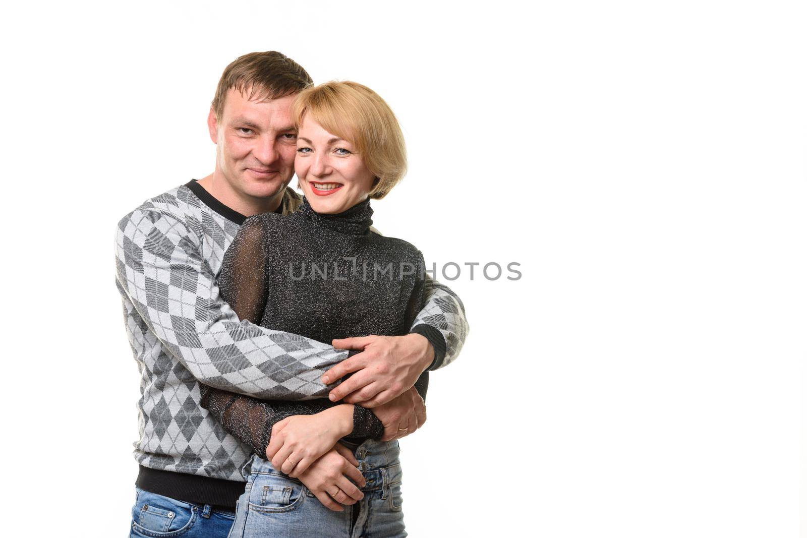 Portrait of a young couple, a man hugging a woman, isolated on a white background by Madhourse