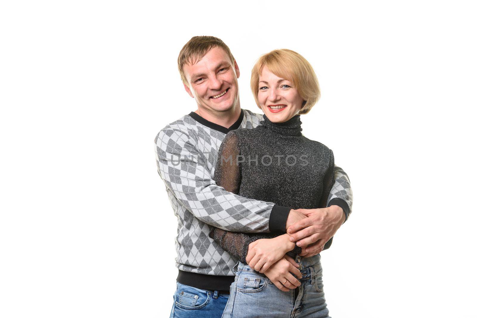 Portrait of smiling couple in casual clothes, isolated on white background