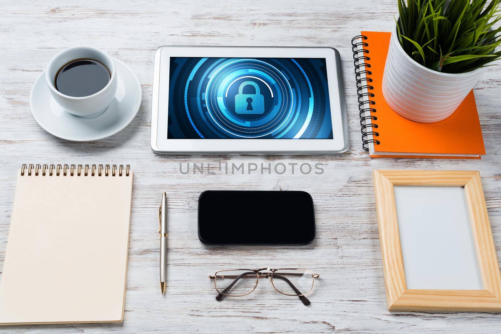 Web security and technology concept with tablet pc on wooden table by adam121