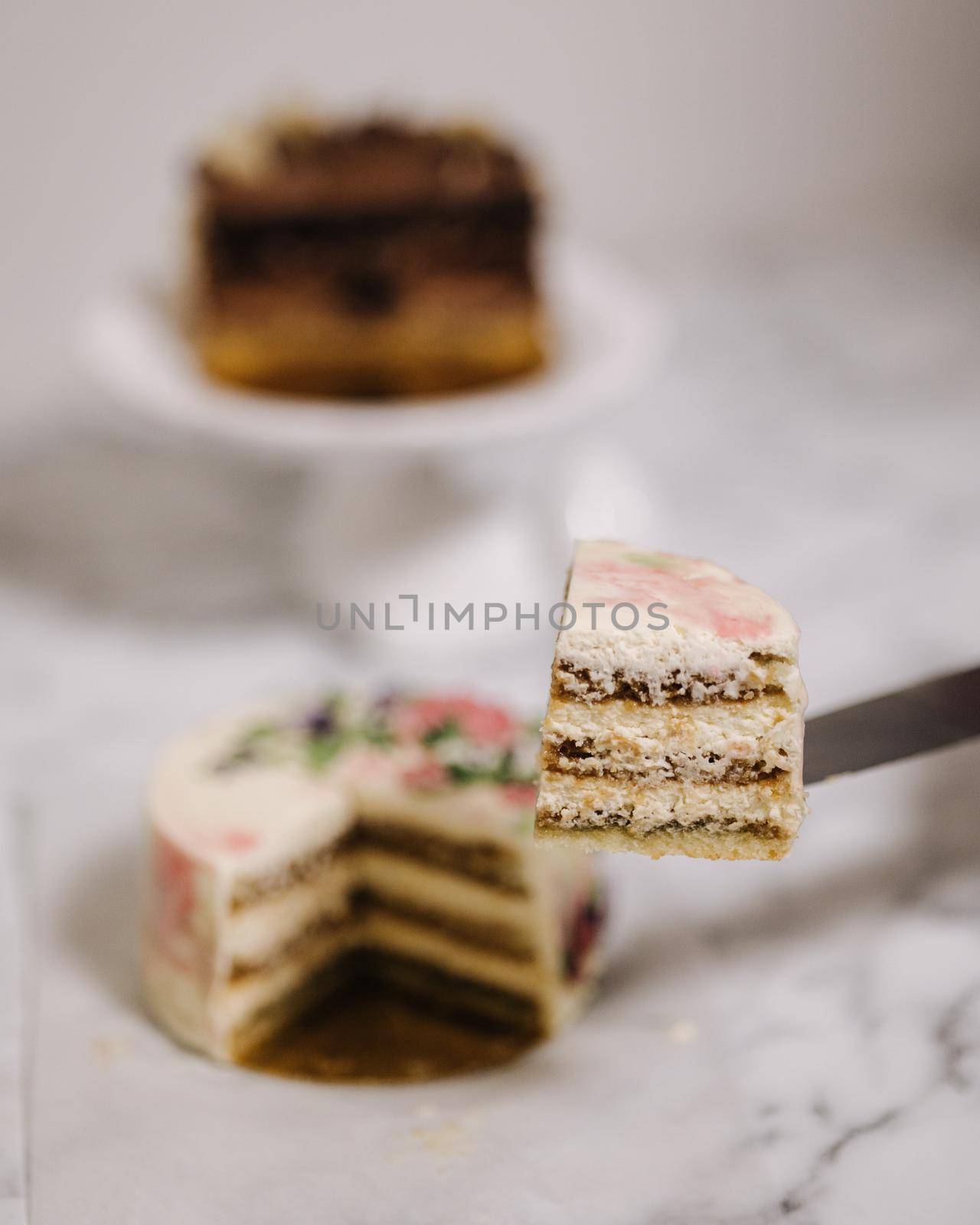 Slice of tiramisu bento cake. Presentation of cake in section. Sweet dessert for one person. Little birthday cake.