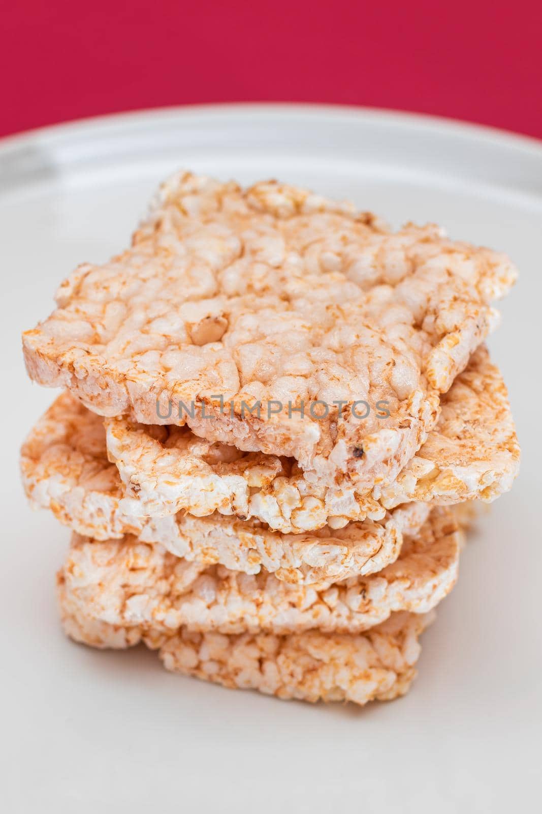 A Stack of Square Rice Cakes on White Plate. Dietary Crispbread