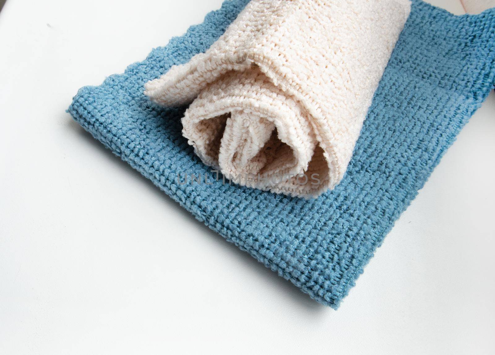 Close-up of two microfiber cleaning cloths, top view. Lying flat, a copy of the space.