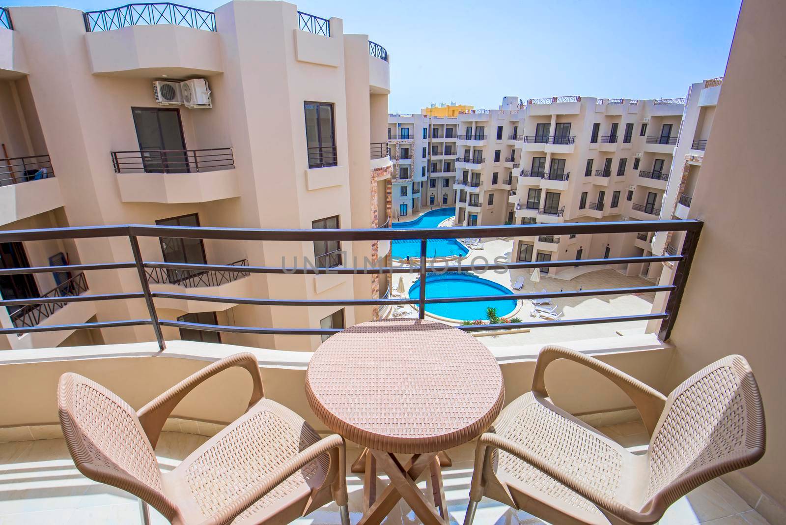 Terrace balcony with chairs in tropical luxury apartment resort by paulvinten