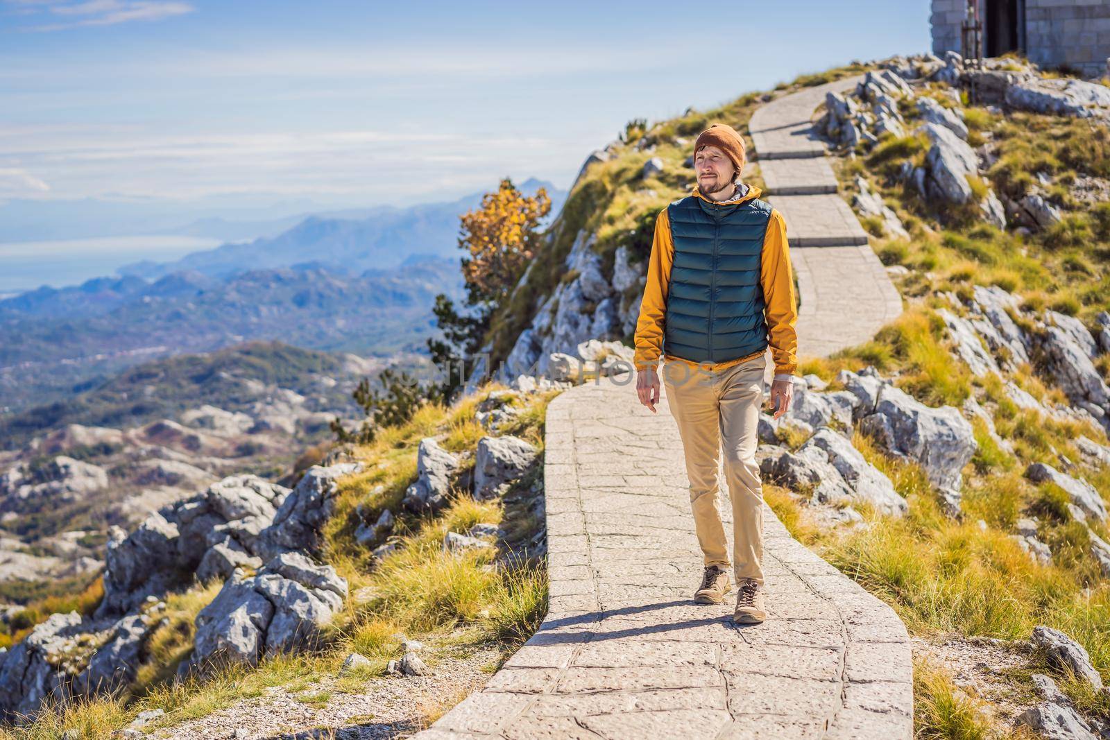 Man traveller in mountain landscape at national park Lovcen, Montenegro. Travel to Montenegro concept.