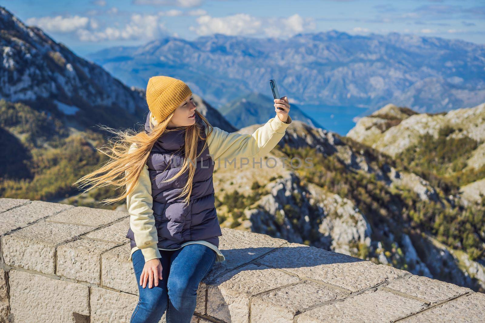 Woman traveller in mountain landscape at national park Lovcen, Montenegro. Travel to Montenegro concept by galitskaya