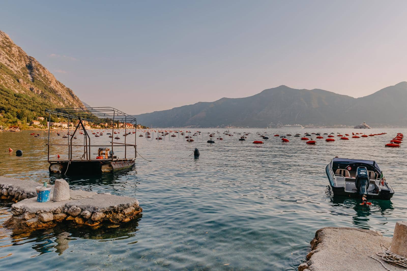 Fishing boat on an oyster farm in the Bay of Kotor, Montenegro. High quality photo.