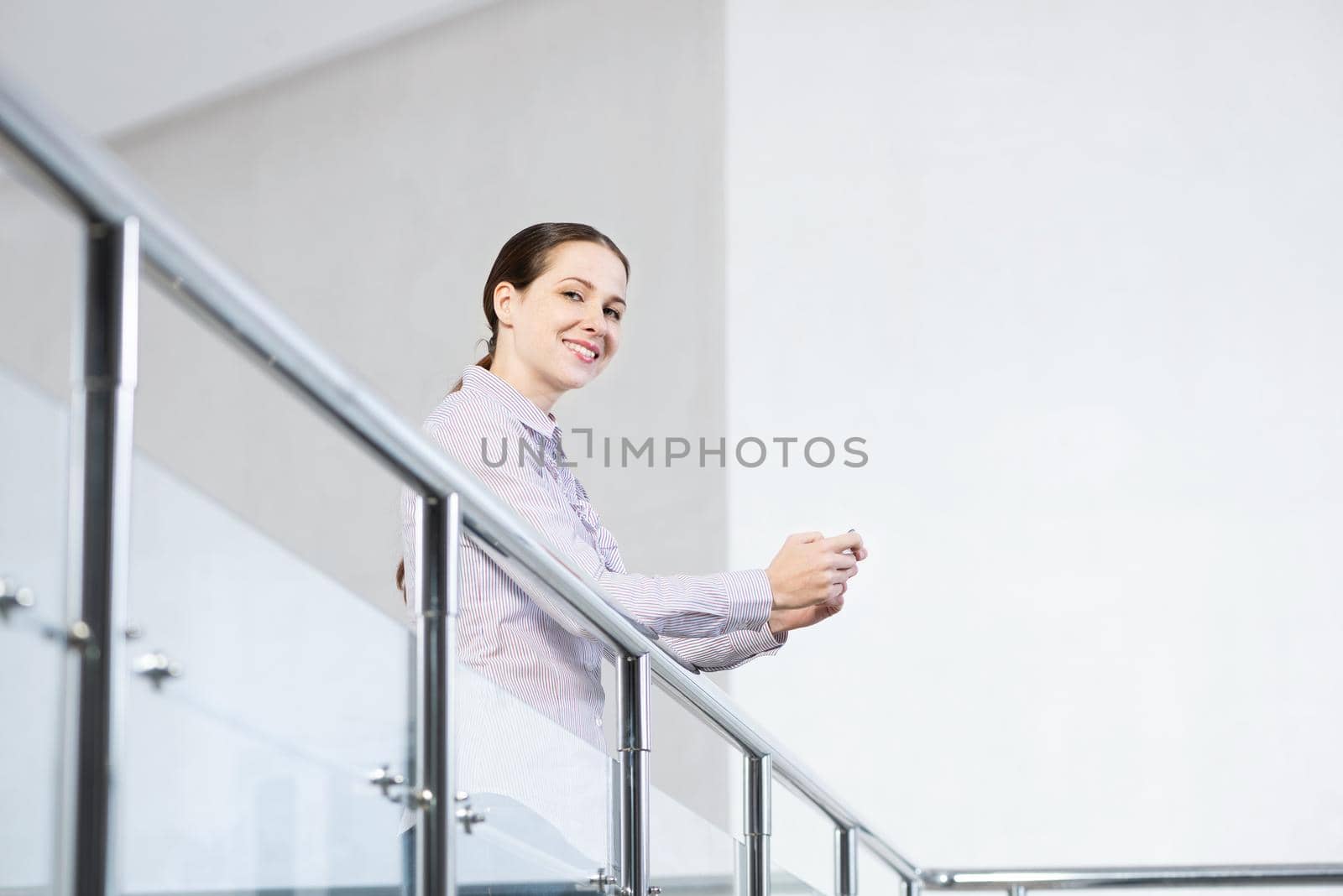 young attractive woman with phone in her hands by adam121