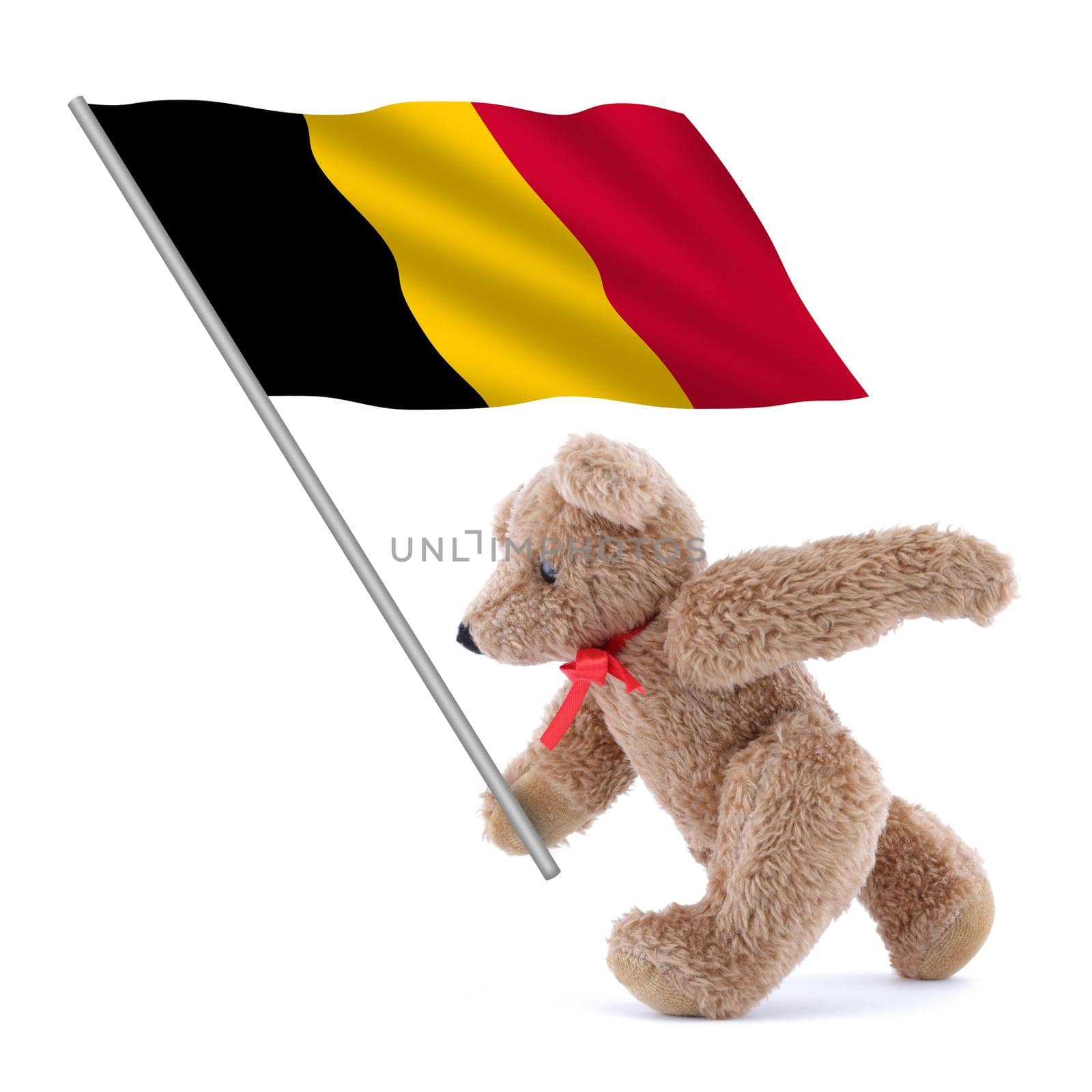 A Belgium flag being carried by a cute teddy bear