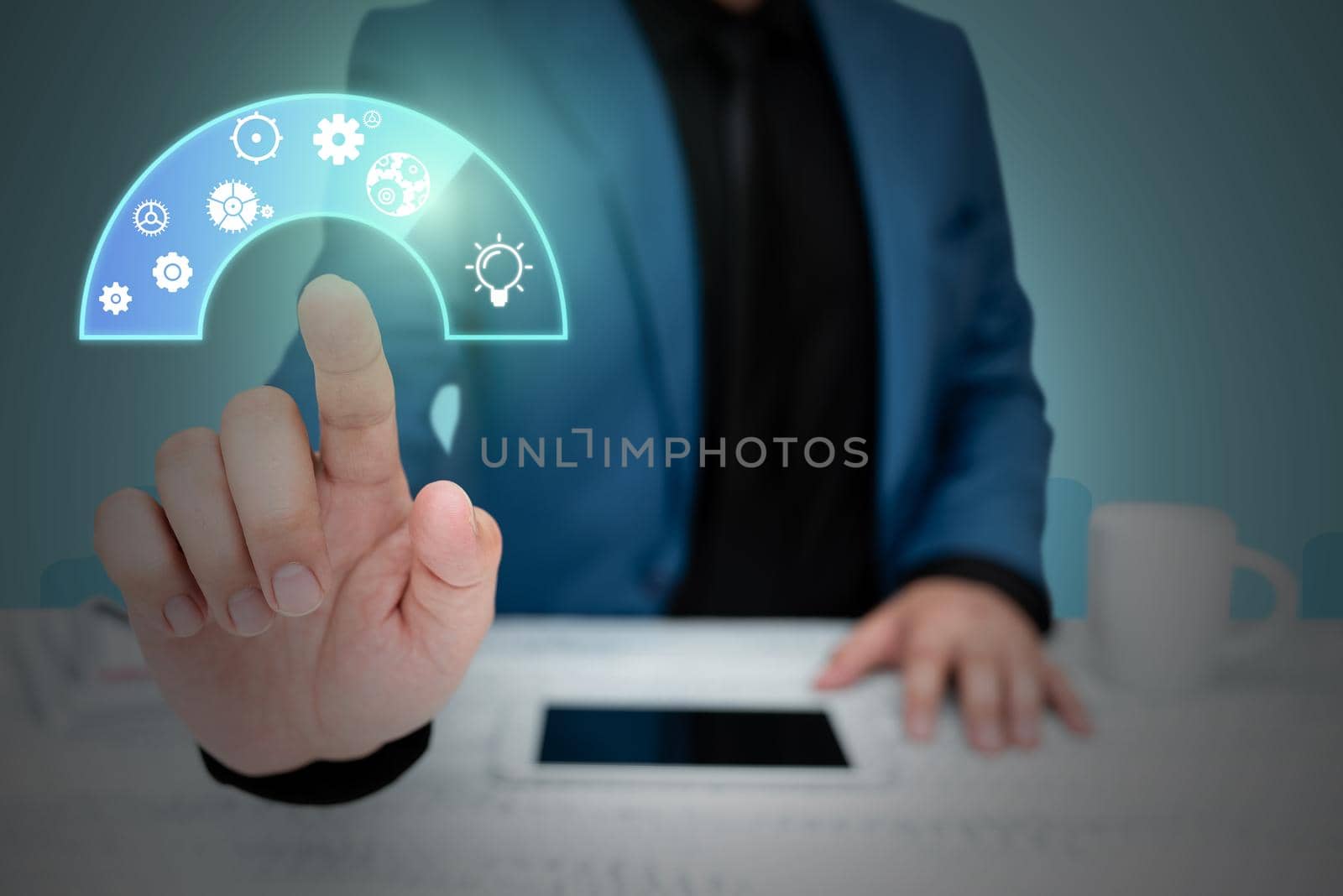 Businessman in suit pointing upwards representing innovative thinking.