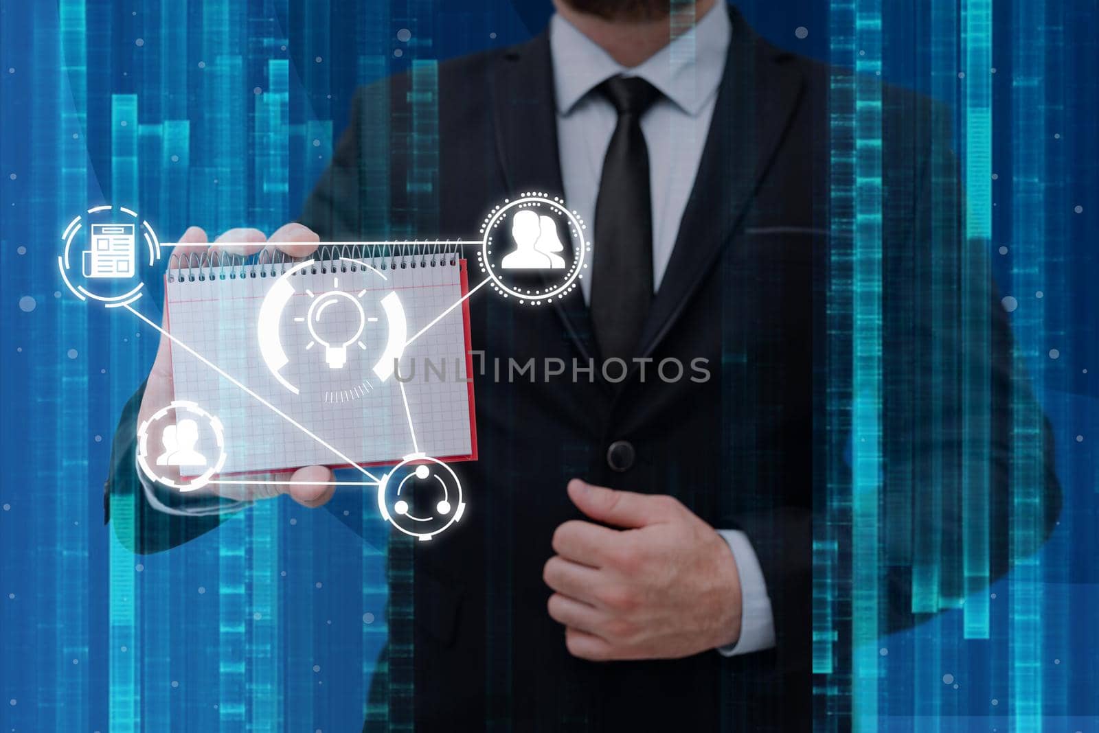 Businessman in suit holding notepad representing innovative thinking.