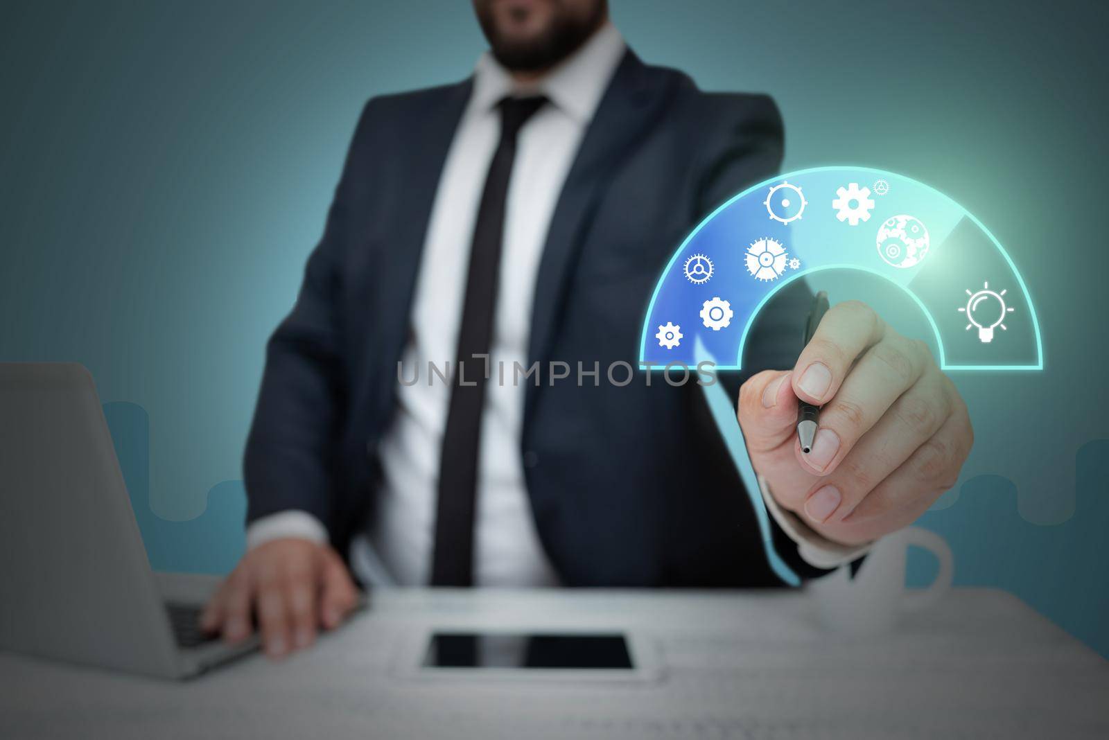 Businessman in suit holding pen representing innovative thinking.