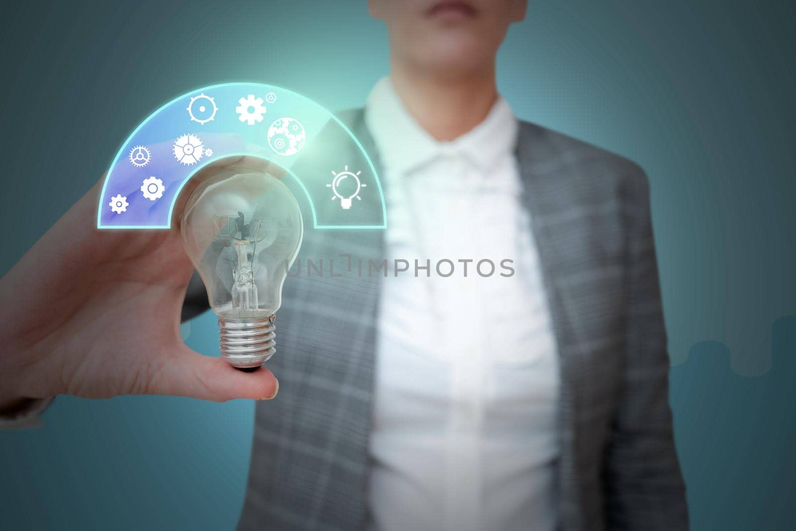 Lady in suit holding light bulb representing innovative thinking.