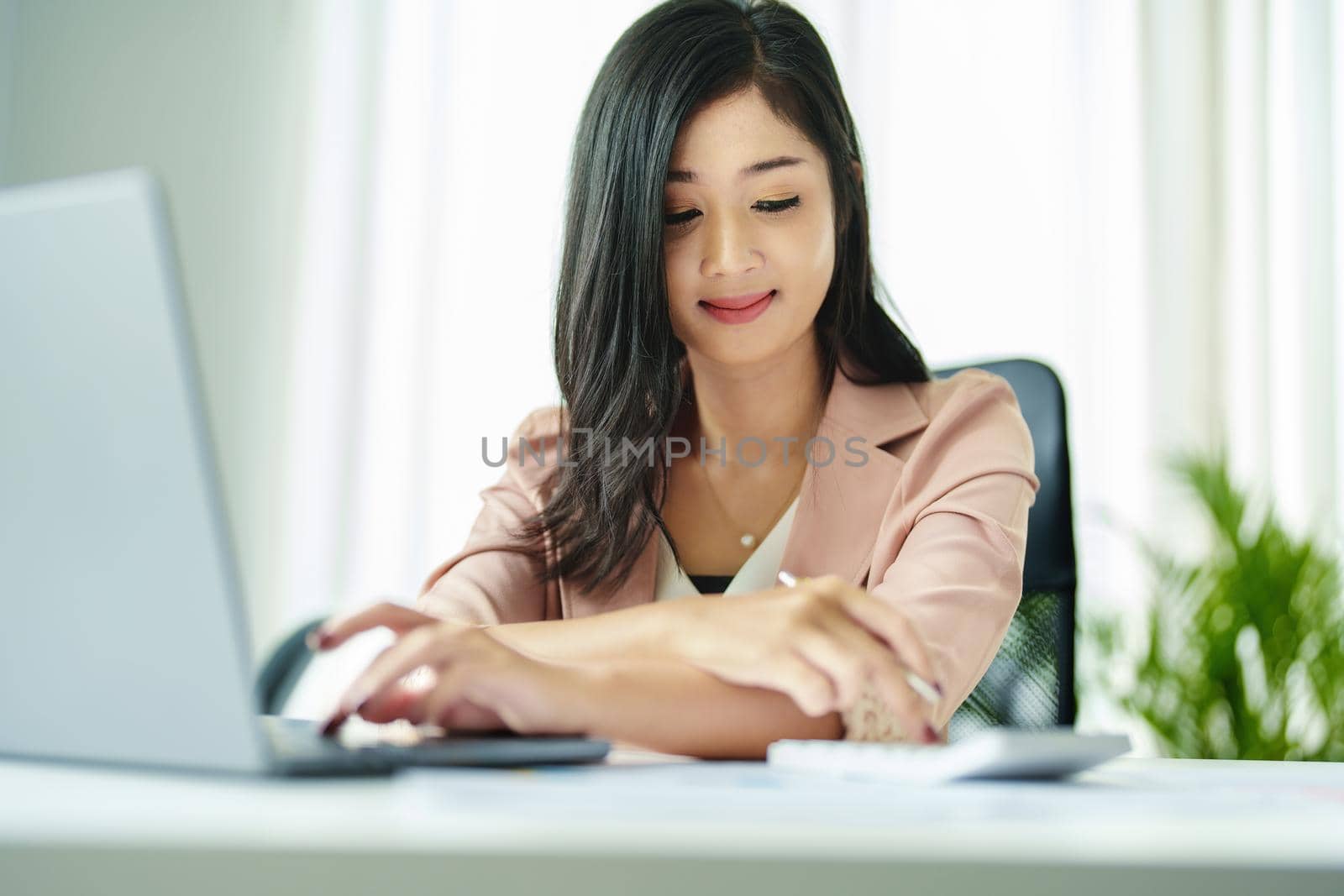 accountant, Auditor, Self-Employed, Finance and Investment, tax calculation and budget, Portrait of Asian female entrepreneur using a calculator to calculate. Company business results document. by Manastrong