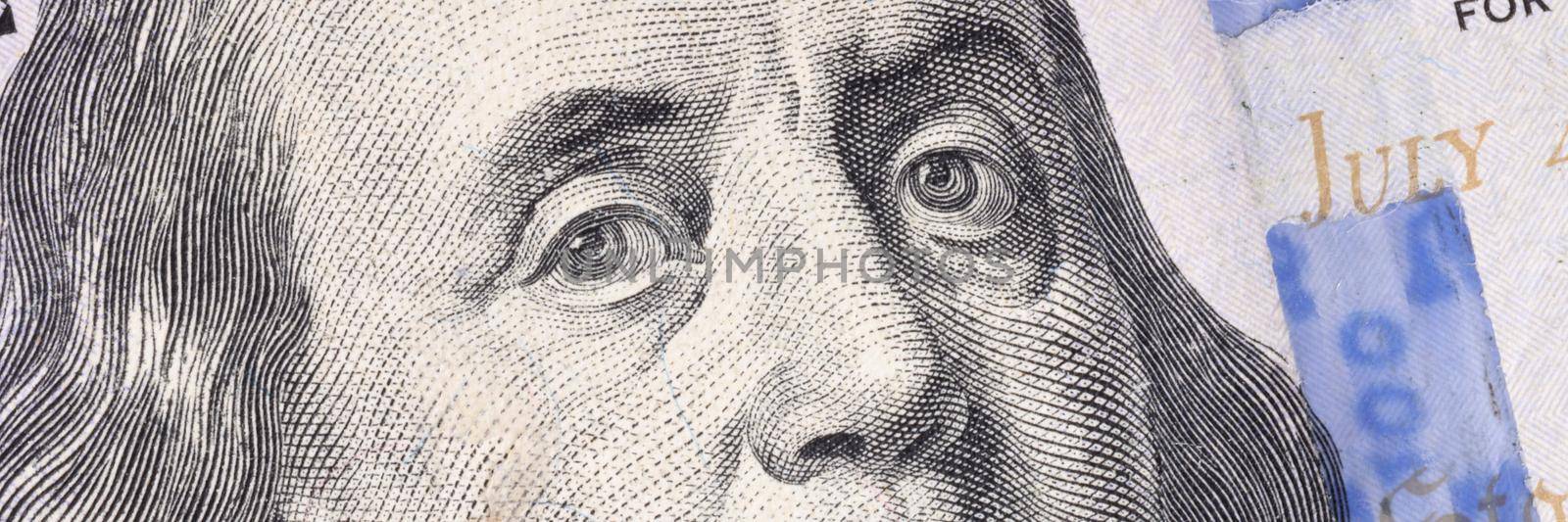 Closeup of Ben Franklin on one hundred dollar bill background by kuprevich