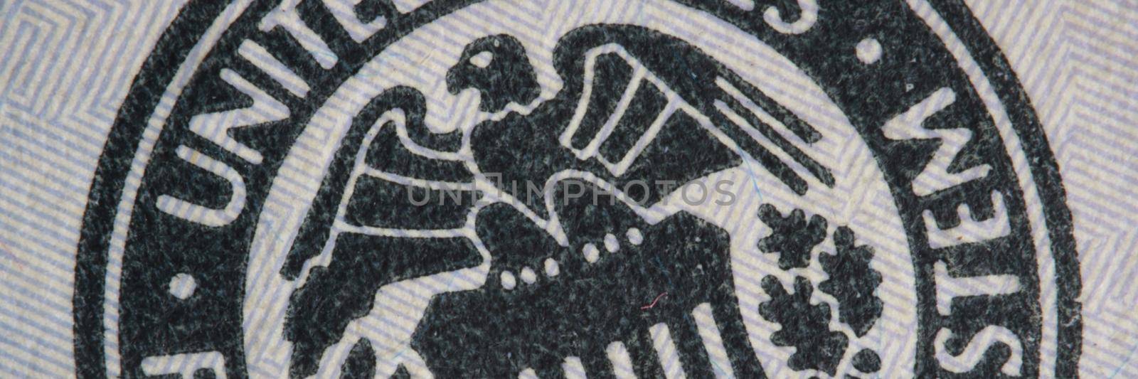 Closeup of coat of arms of United States of America on dollar bill background. America politics and economy concept