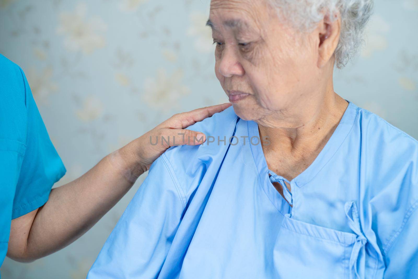 Touching Asian senior or elderly old lady woman patient with love, care, helping, encourage and empathy at nursing hospital ward, healthy strong medical concept