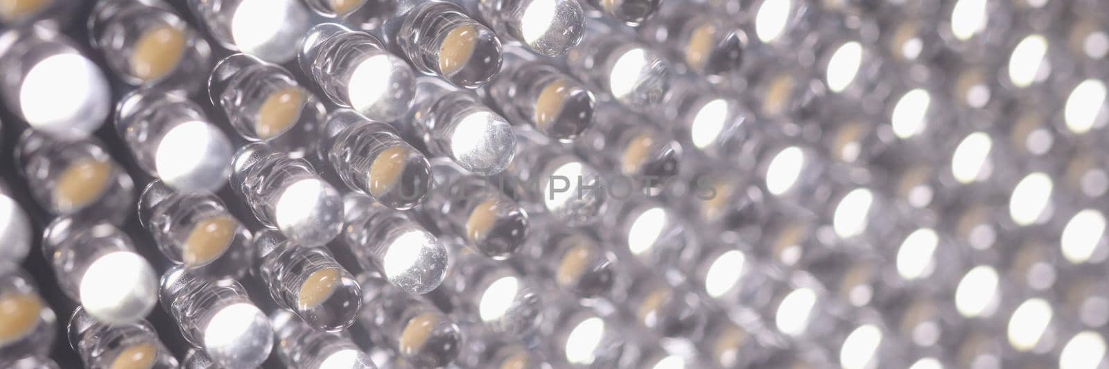 Closeup of lots of bright leds in lamp background. Energy saving lamps concept
